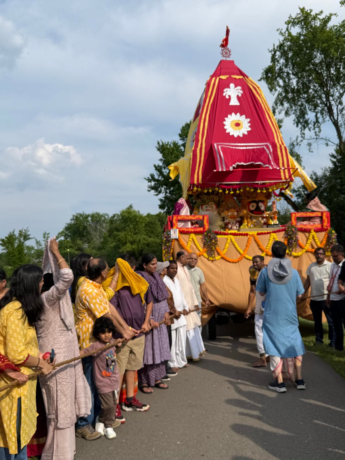 Devotees pulling Lord Jagannath's chariot through Heritage Park
